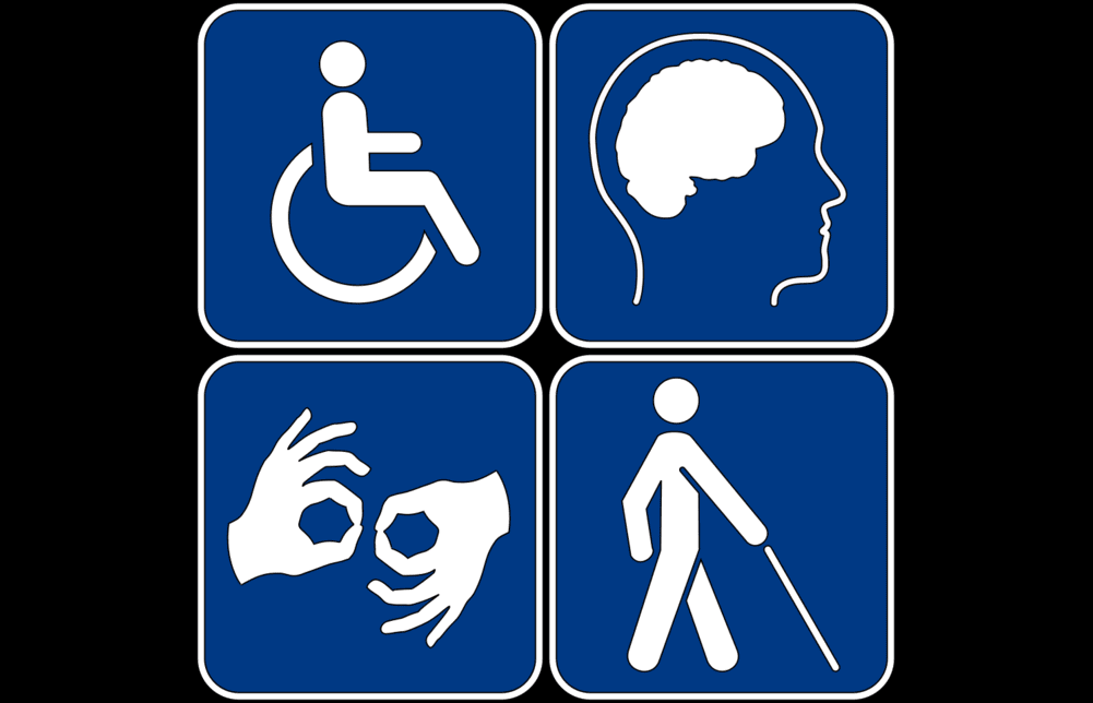 A montage of four pictograms showing disability symbols for wheelchair access, low vision access, sign language interpretation and autism brain, blue on a white background