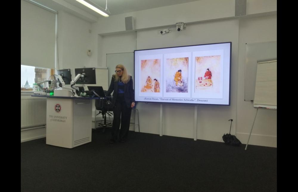 Photo of Raad Khair Allah presenting her research at a seminar